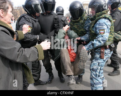 Riot police OMON arresting participants of the `Dissenters` March in St.Petersburg. Protesters shouted for St.Petersburg`s Governor Valentina Matviyenko to resign and called President Vladimir Putin an enemy of the state. Stock Photo